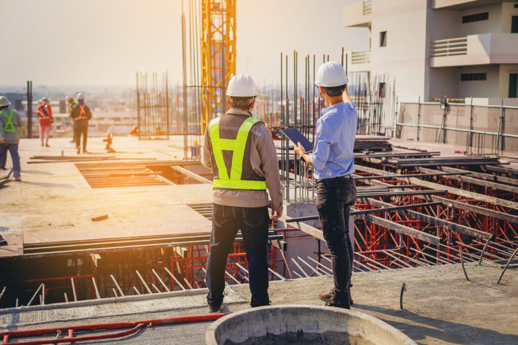 structural engineer and foreman worker with touch pad discuss, p